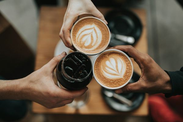 Two flat whites with latte art