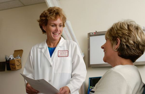 A clinician talking a patient through her treatment