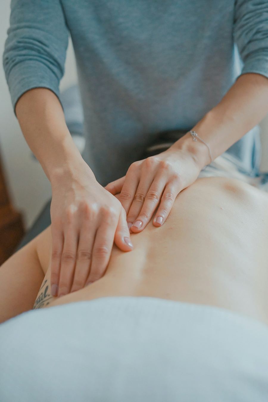 A physiotherapist treating a patient's back