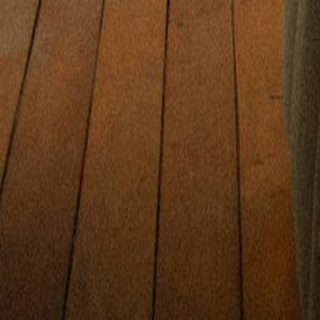 Tropical hardwood decking in warm shadow.